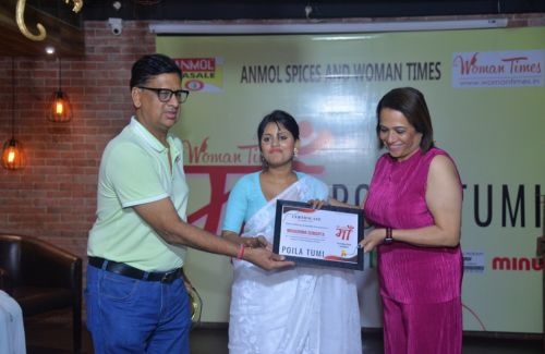Madhurima Sengupta receiving award from woman times